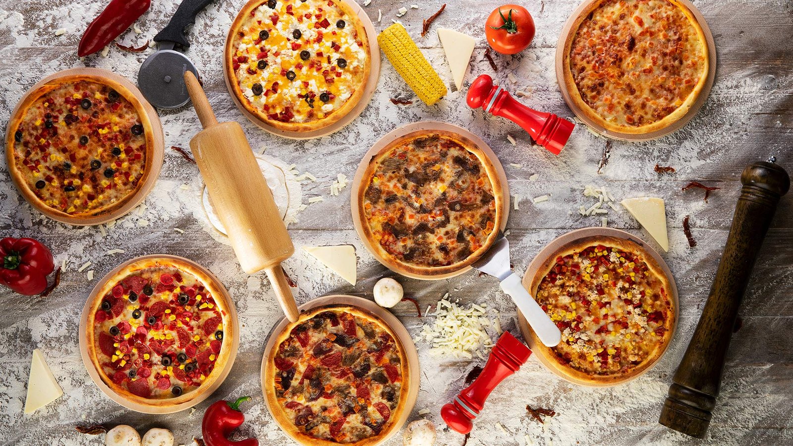 Assorted gourmet pizzas photographed from above for restaurant menu, food advertising and commercial food photography