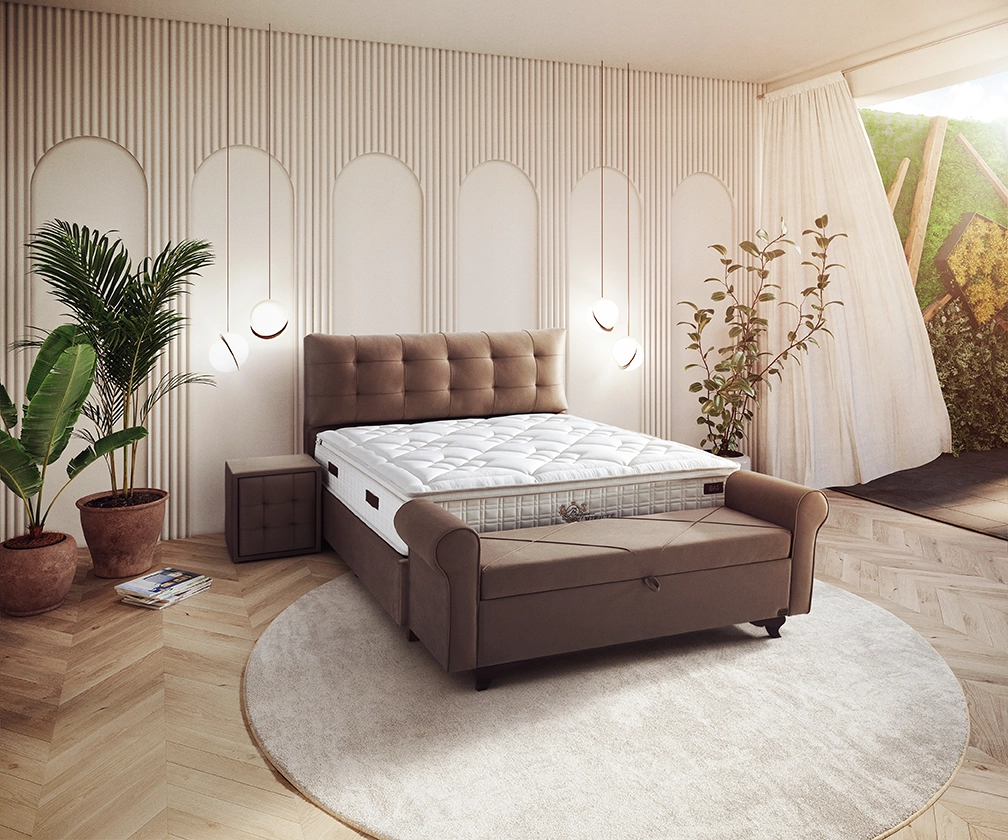 Stylish İDAŞ bedroom featuring a premium mattress and upholstered bed frame in a warm contemporary interior.