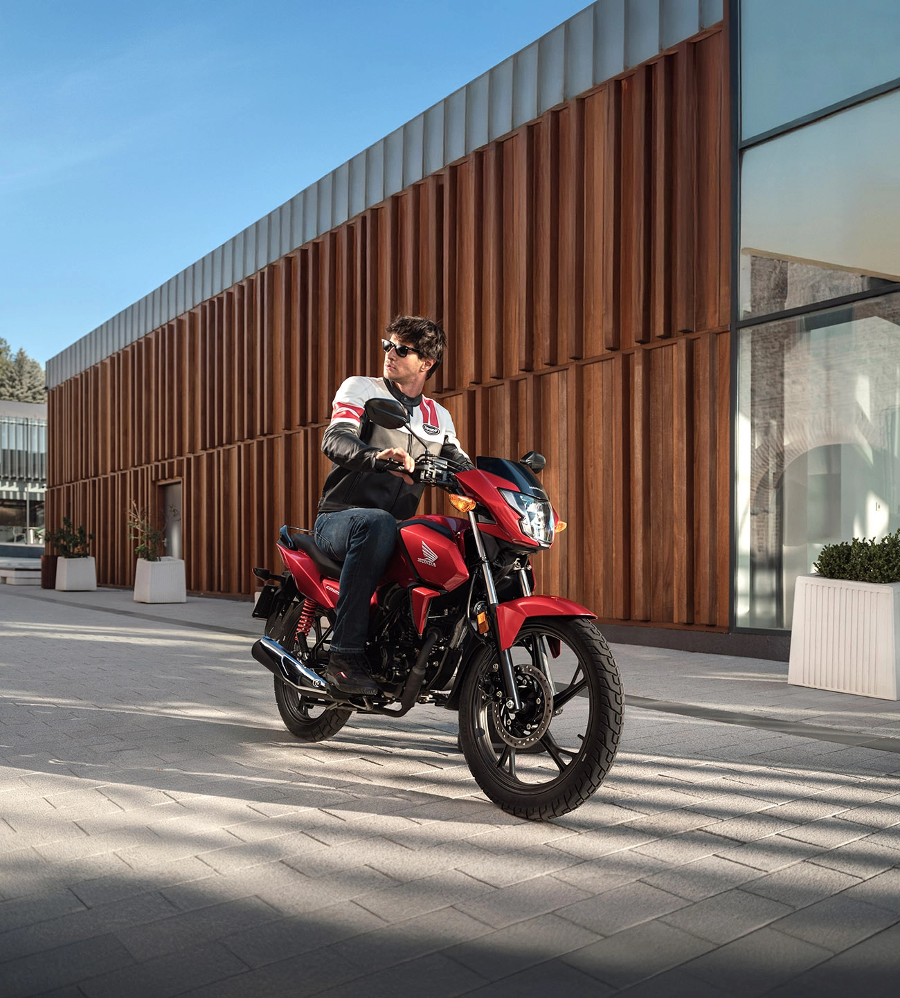 Honda adventure motorcycle rider in urban environment