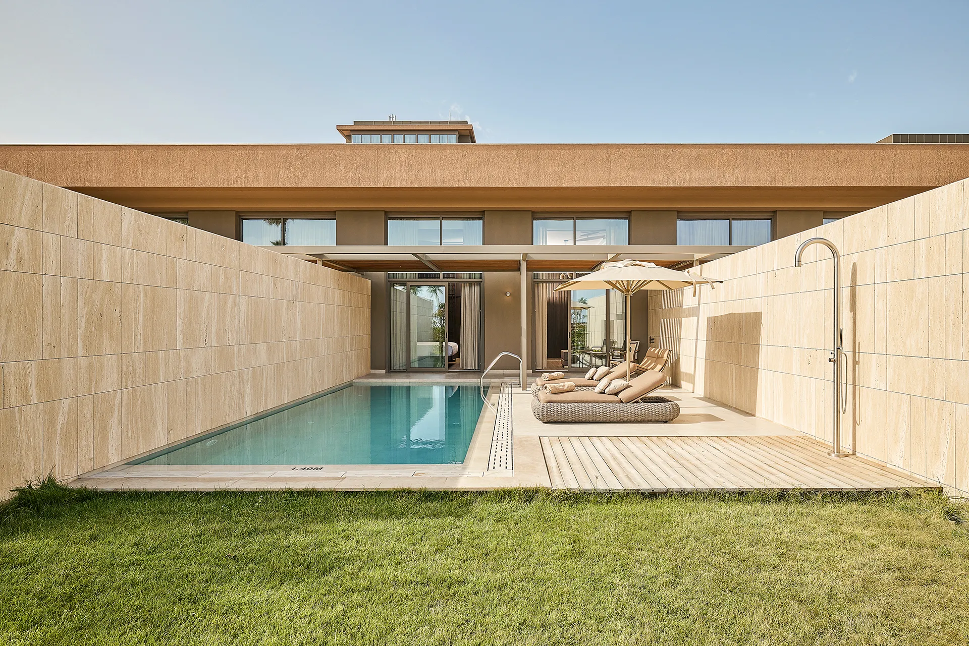 Private pool villa at Lusso Resort featuring contemporary architecture, a secluded swimming pool, and luxury outdoor living spaces