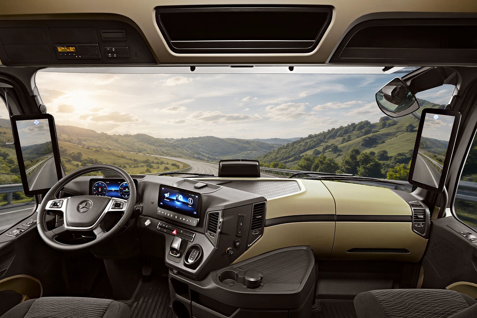 Mercedes-Benz Actros truck cabin interior with highway and mountain landscape visible through the windshield.