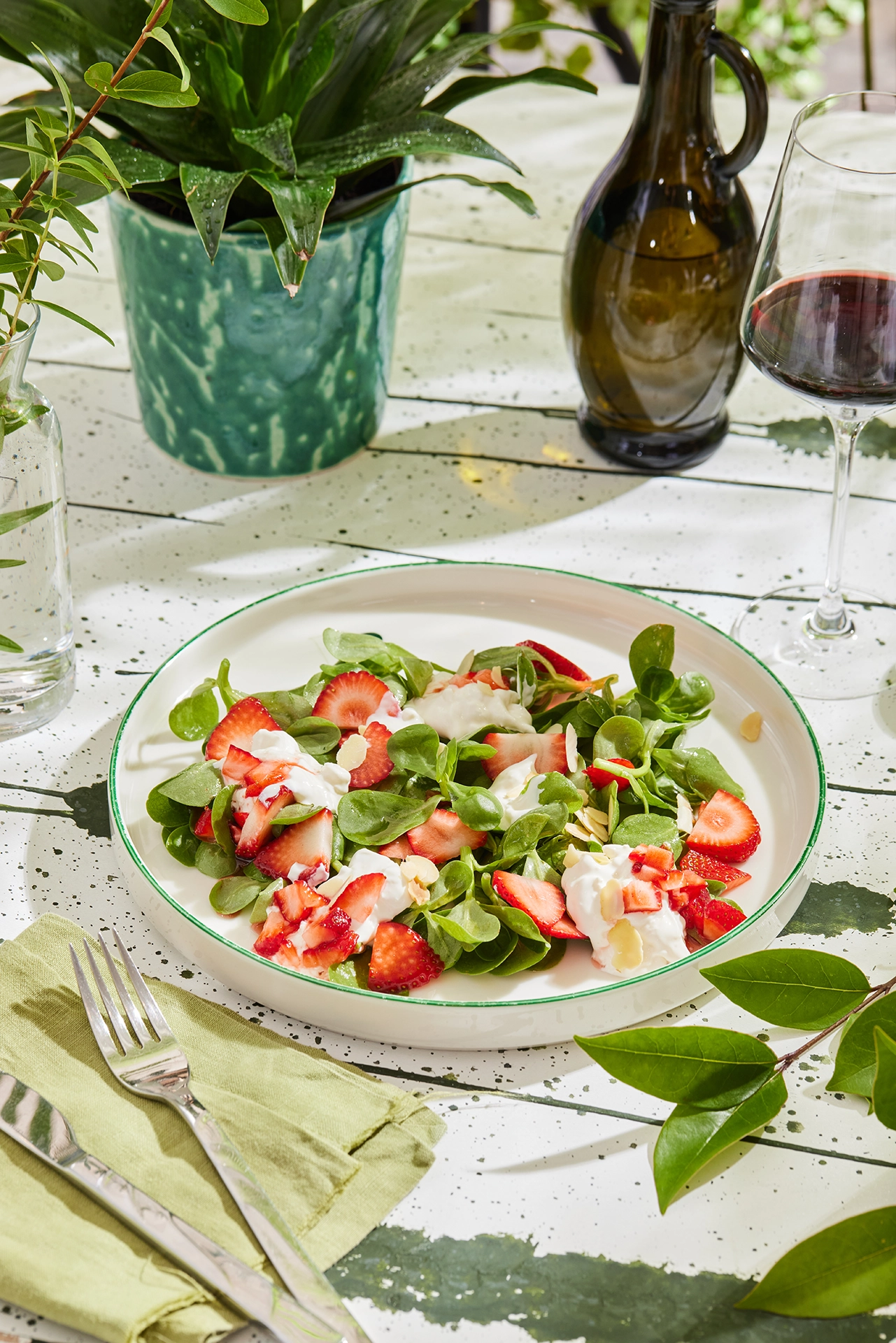 Fresh gourmet salad prepared with seasonal vegetables and premium ingredients, presented in an elegant dining setting.
