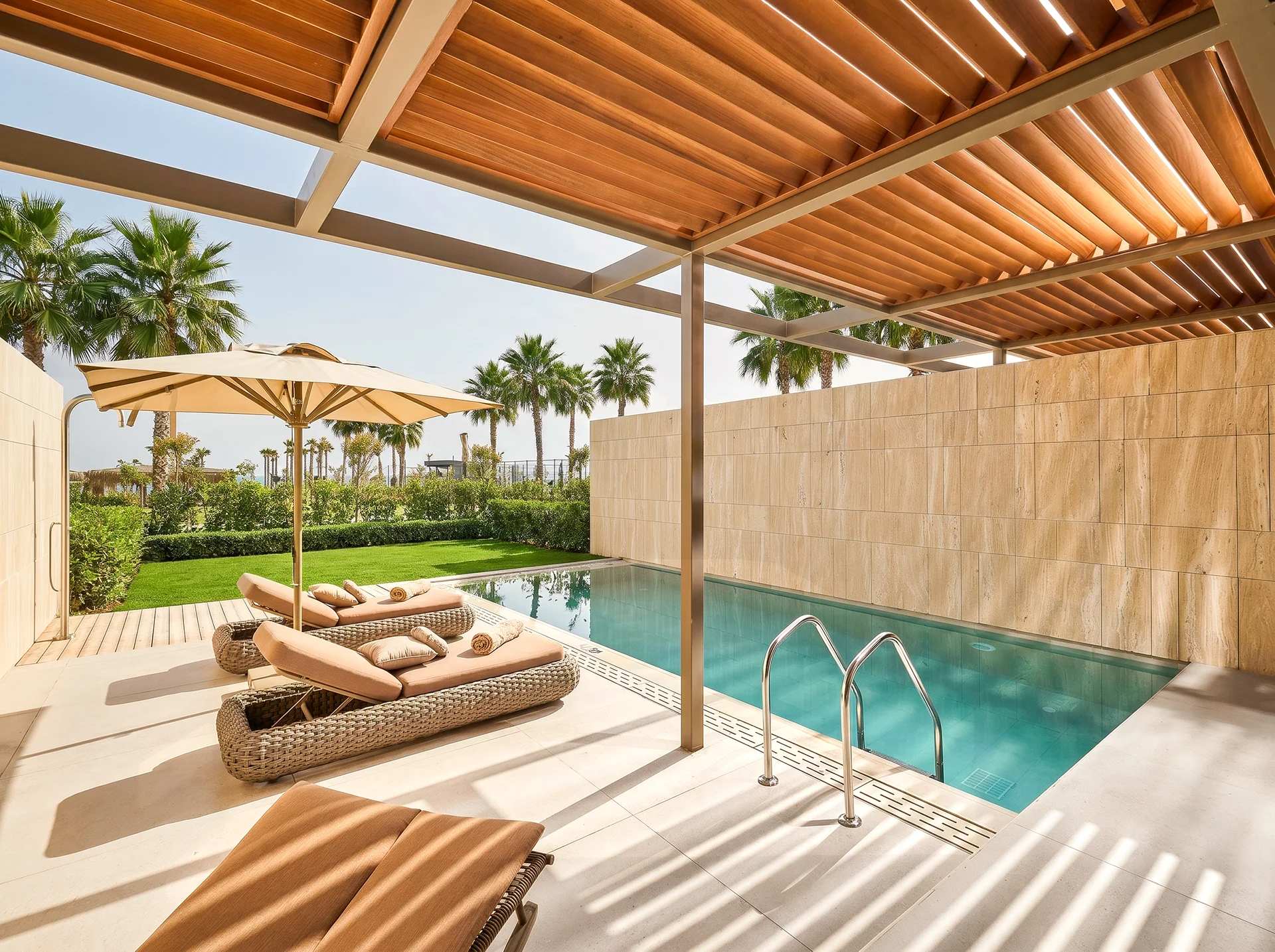Hospitality and interior photography showcasing a contemporary living space at Lusso Resort. The image highlights premium materials, warm wood textures, designer lighting, and modern architectural details that create an elegant and welcoming atmosphere. Designed to reflect the resort’s commitment to luxury, comfort, and timeless Mediterranean-inspired design.