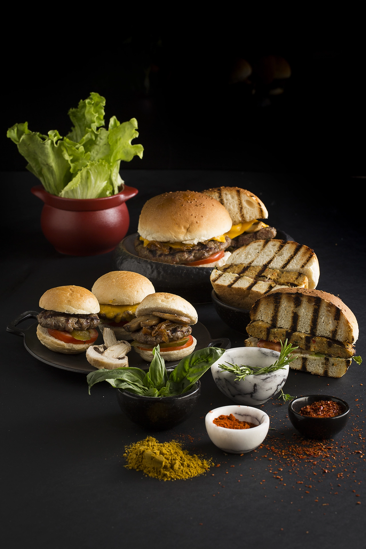 Gourmet burger selection served with fresh ingredients and artisan bread in a premium food photography composition.