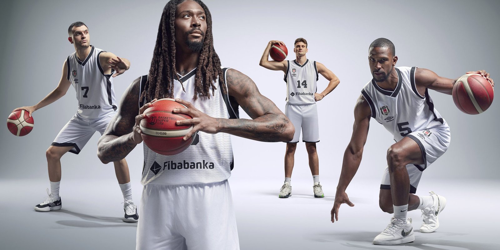 Beşiktaş basketball players featured in a commercial campaign shoot for Fibabanka, posing with basketballs in a professional studio setting