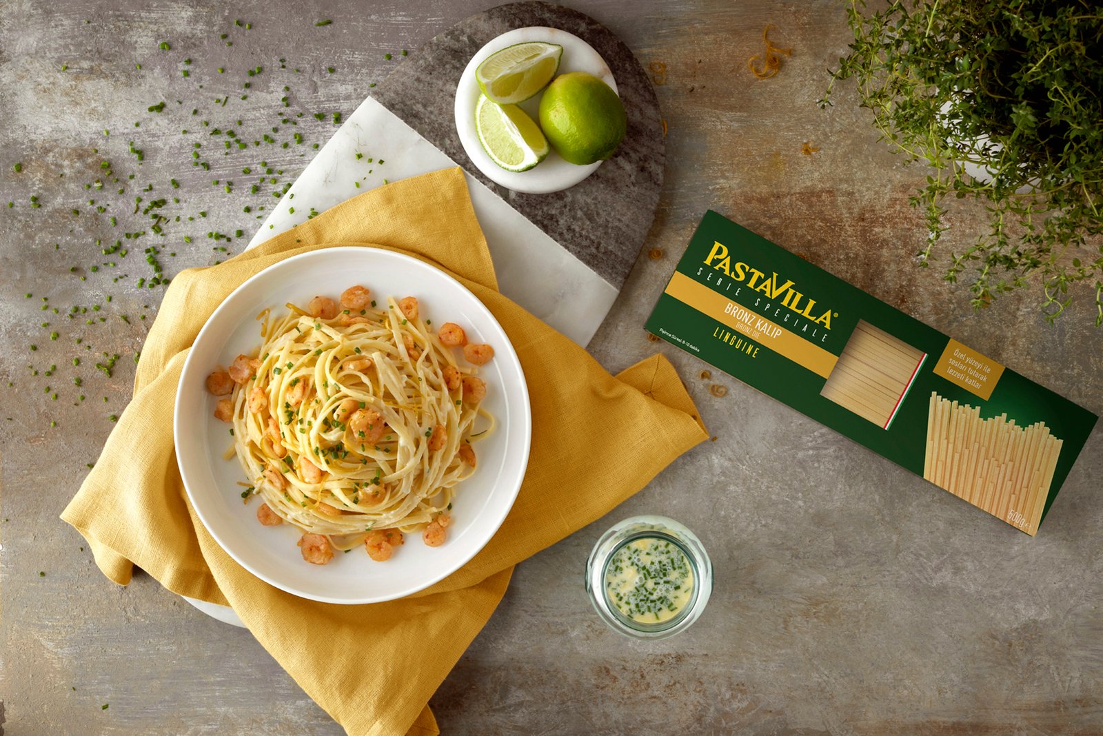 Professional commercial food advertising photographs by Sinan Niyazi Kutsal capturing a Pastavilla Bronze Die Linguine shrimp flat lay, a vegetable tricolor pasta salad, and a fork twirling spaghetti over a rustic tabletop.