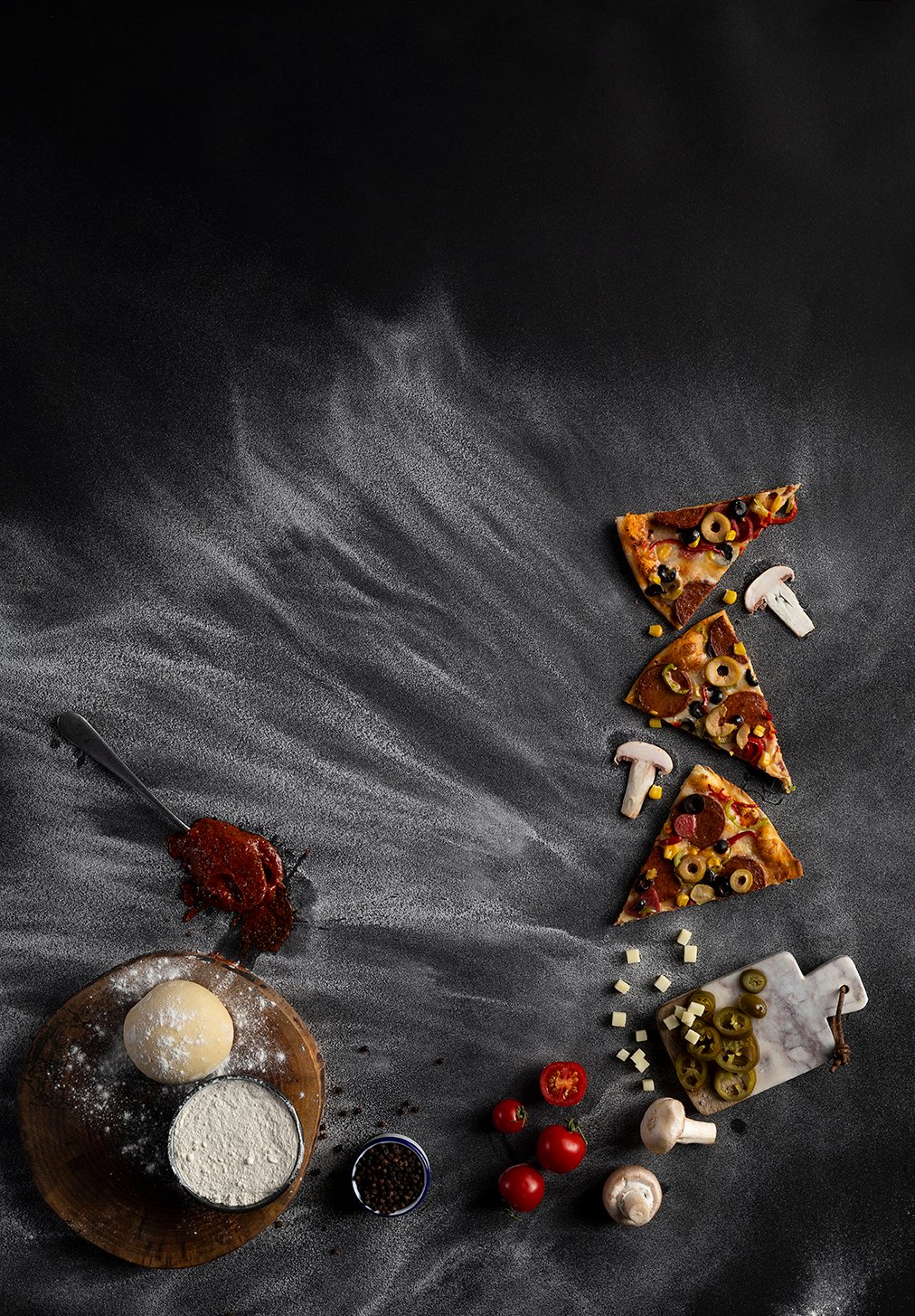 Professional commercial food advertising photographs by Sinan Niyazi Kutsal capturing freshly baked artisanal pizzas topped with melted mozzarella, tomatoes, and basil on a rustic wooden platter.