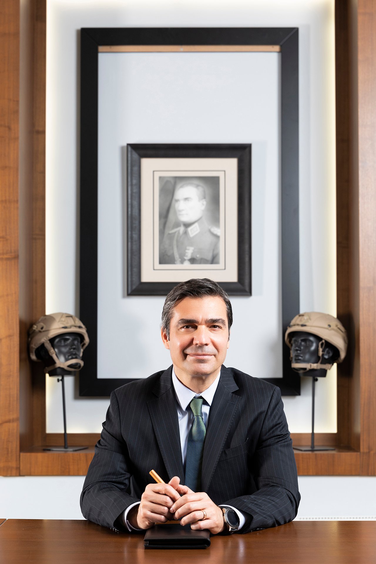 Professional executive portrait photographed in a corporate office environment.