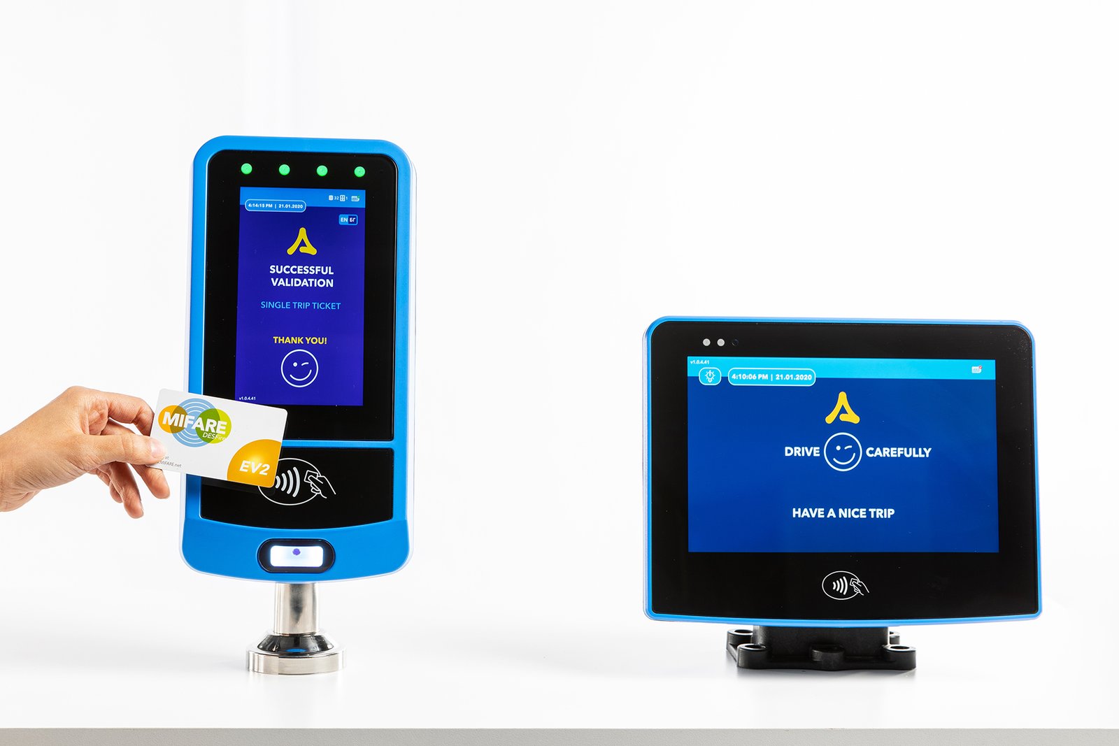 Professional commercial product photograph by Sinan Niyazi Kutsal for Asis Electronic, showcasing a blue electronic bus validator screen scanning a MIFARE smart card next to a digital driver console display over a seamless white background.