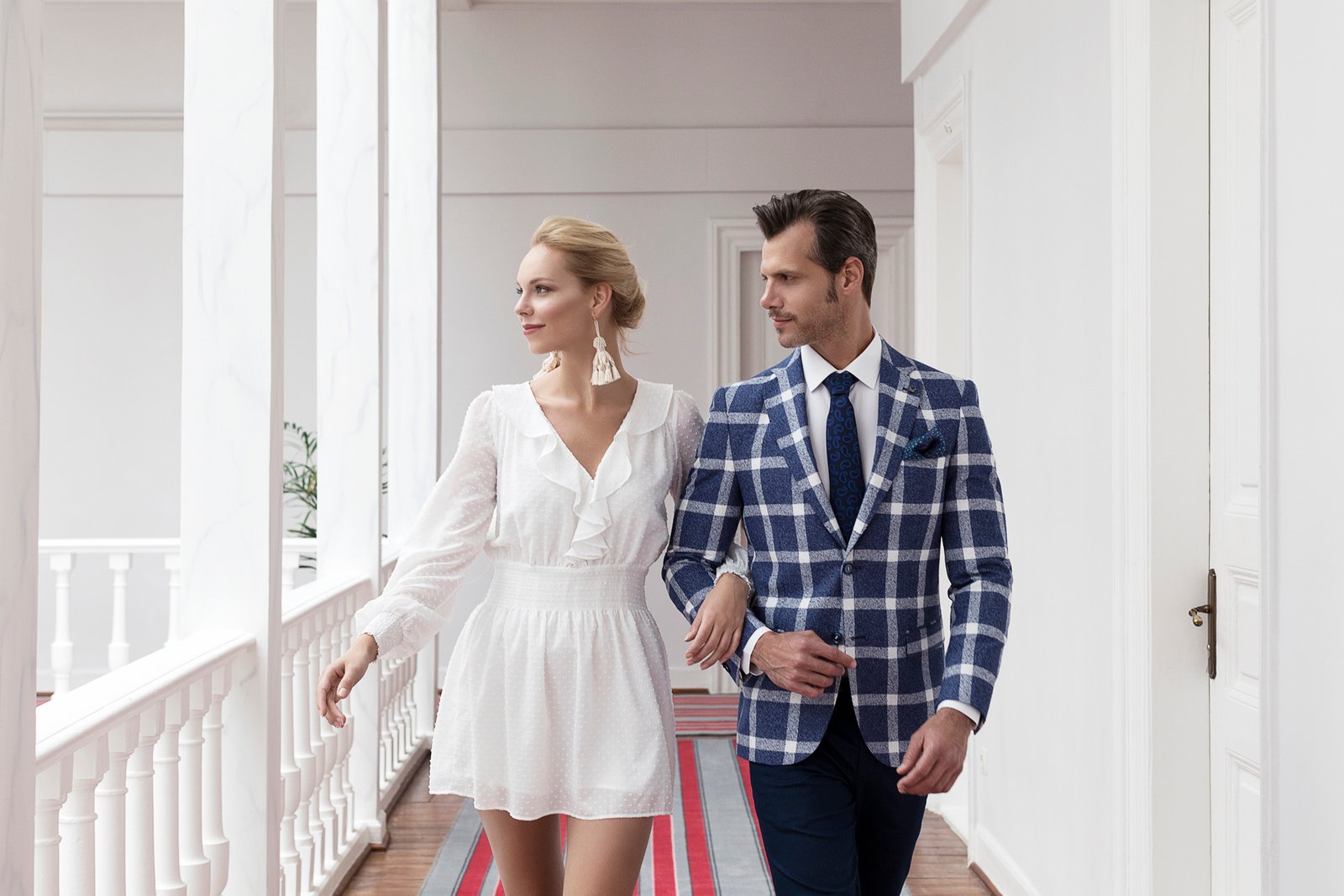 Professional commercial fashion advertising photographs by Sinan Niyazi Kutsal for Paul Mark, capturing models in upscale new season clothing inside an antique mansion parlor and walking along historical street fronts in Buyukada, Istanbul.