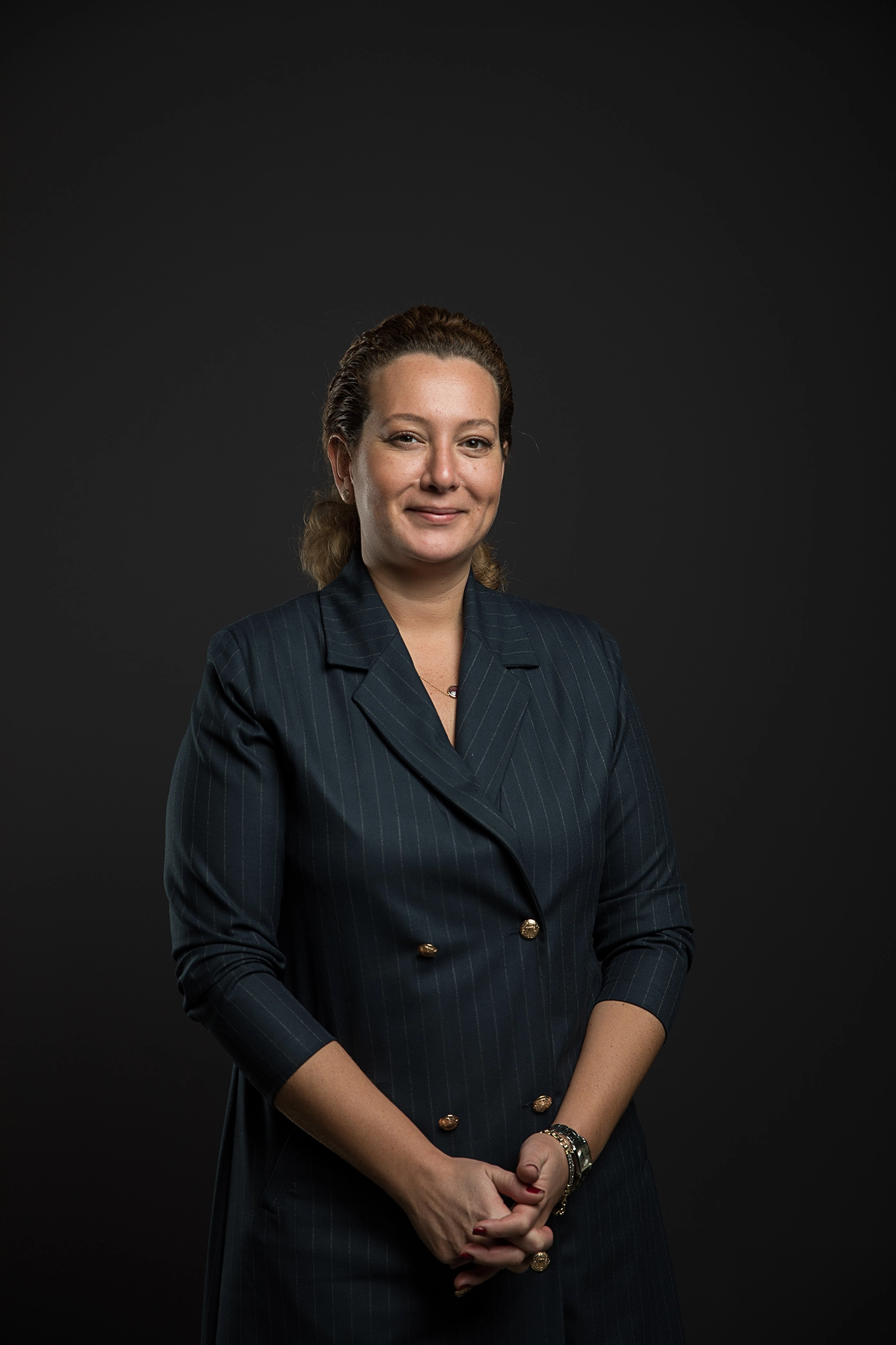 Professional portrait of a female business executive photographed in a studio environment for corporate branding and leadership communications.