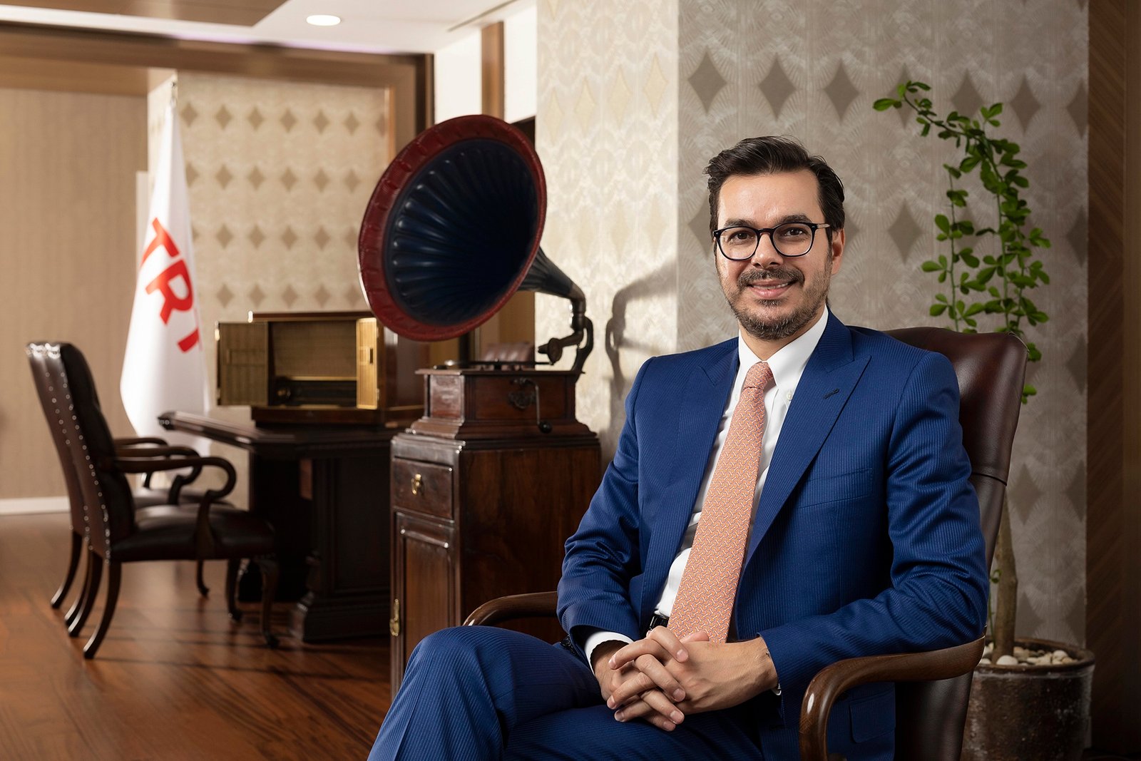 İbrahim Eren, Director General of TRT, seated in his office at TRT Headquarters in Ankara wearing a blue suit.