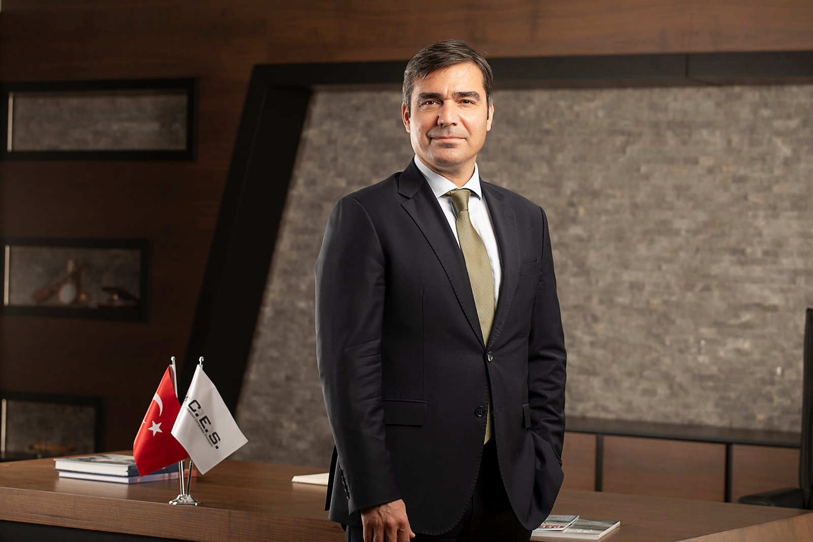 Professional executive portrait photographed in a corporate office environment.