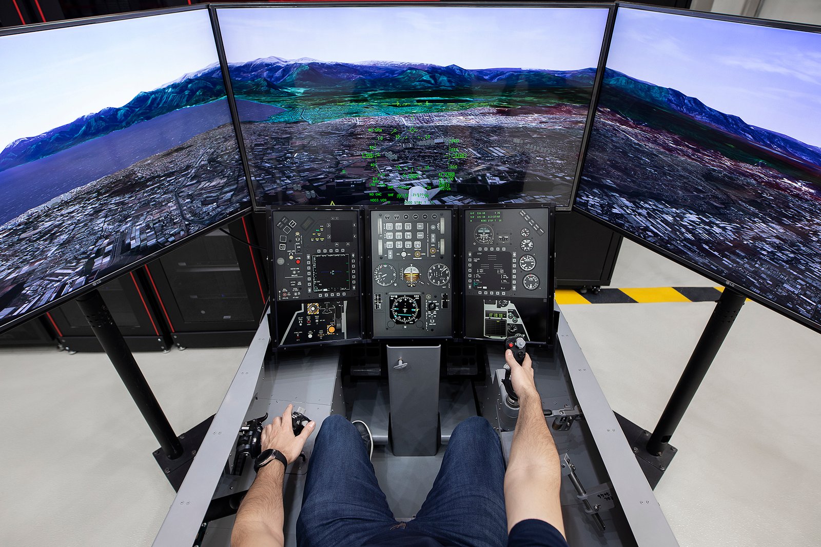 Professional commercial corporate photographs by Sinan Niyazi Kutsal for Havelsan, capturing tech engineers and corporate professionals monitoring advanced digital screens, coding, and testing simulation units inside modern software development laboratories.