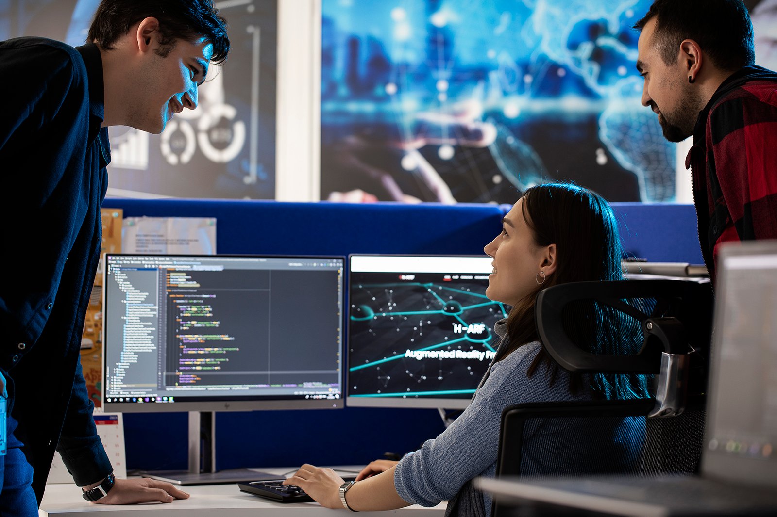 Professional commercial corporate photographs by Sinan Niyazi Kutsal for Havelsan, capturing tech engineers and corporate professionals monitoring advanced digital screens, coding, and testing simulation units inside modern software development laboratories.