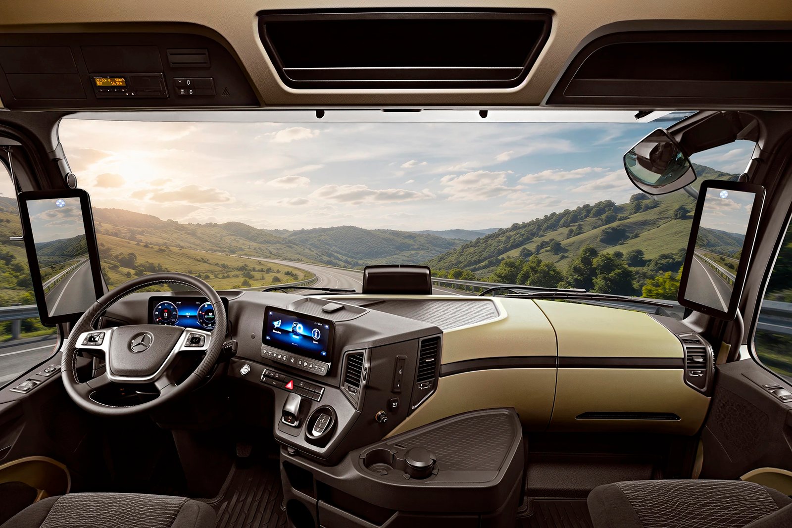 A commercial high-detail interior photograph by Sinan Niyazi Kutsal looking from inside the driver cabin of a Mercedes-Benz Actros truck, showcasing the dual-screen digital cockpit, luxury steering wheel, and innovative MirrorCam displays.