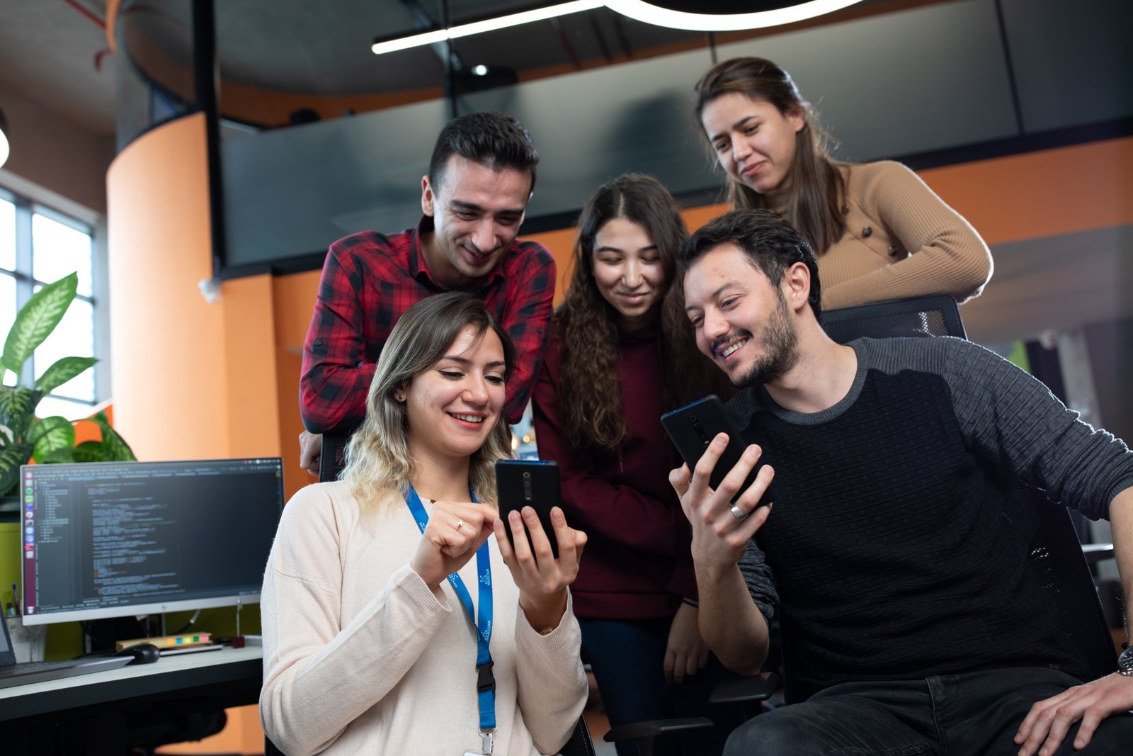 Professional commercial corporate photographs by Sinan Niyazi Kutsal for Havelsan, capturing tech engineers and corporate professionals monitoring advanced digital screens, coding, and testing simulation units inside modern software development laboratories.