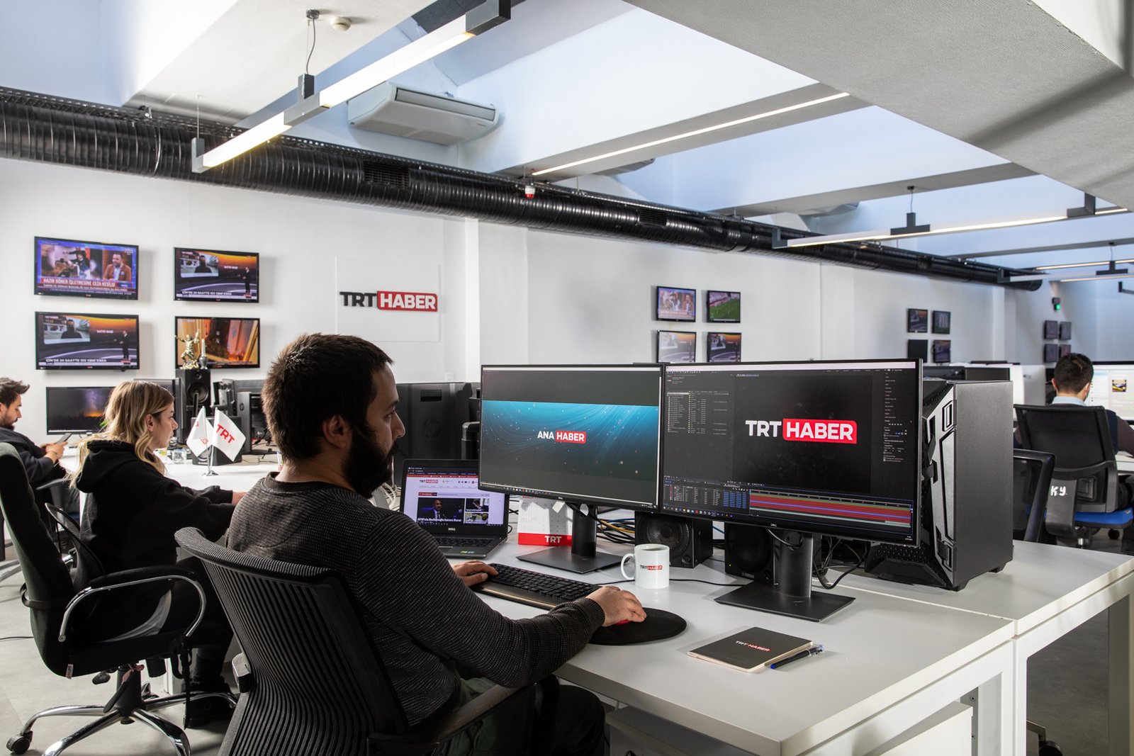 Behind the scenes of TRT Haber television broadcasting operations, featuring news studios, production teams, broadcast technology and media professionals.