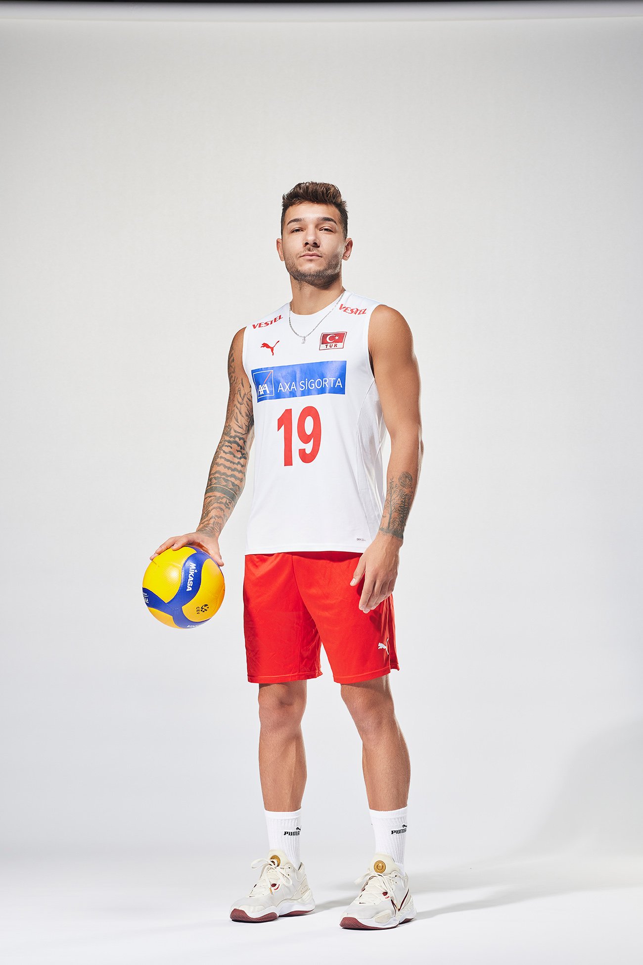 Studio portrait of Berkay Bayraktar wearing the Türkiye Men’s National Volleyball Team uniform.