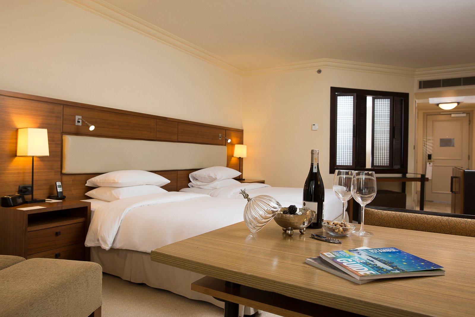 Professional commercial interior architecture photographs by Sinan Niyazi Kutsal showcasing luxury guest rooms and premium suites at Grand Hyatt Istanbul under warm, crisp hospitality lighting.
