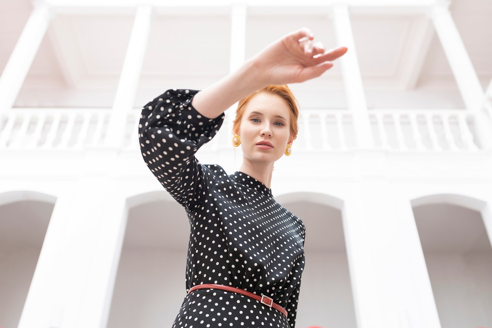 Professional commercial fashion advertising photographs by Sinan Niyazi Kutsal for Paul Mark, capturing models in upscale new season clothing inside an antique mansion parlor and walking along historical street fronts in Buyukada, Istanbul.