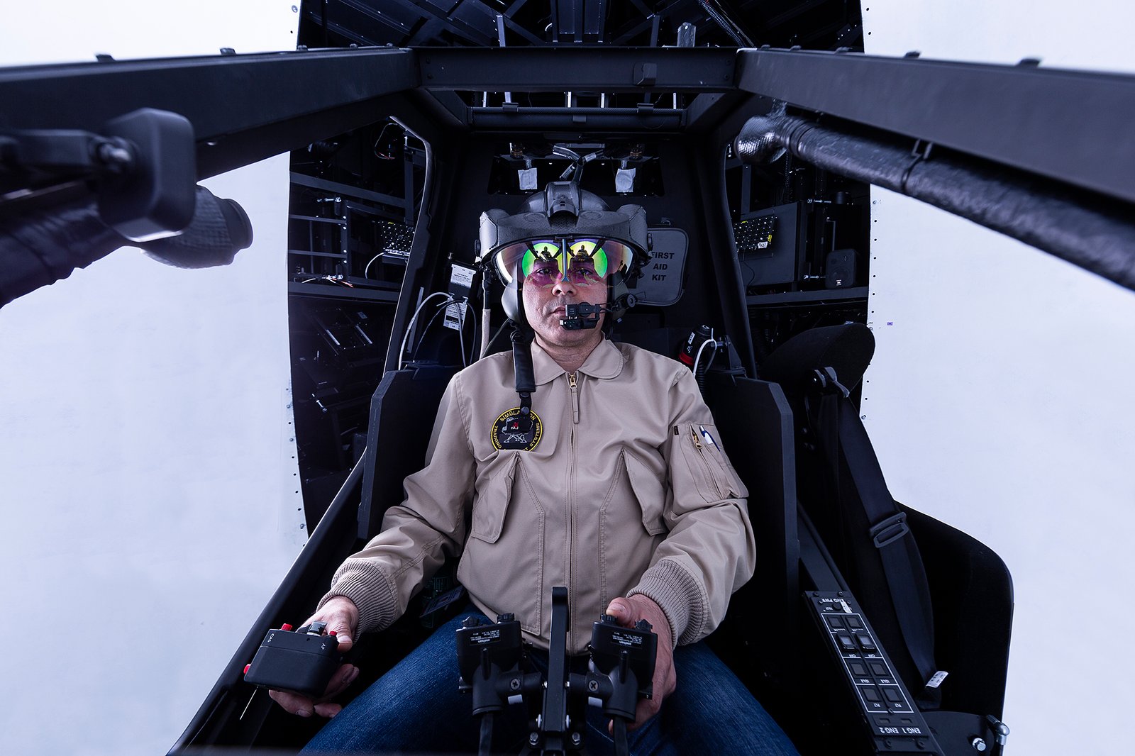 Professional commercial corporate photographs by Sinan Niyazi Kutsal for Havelsan, capturing tech engineers and corporate professionals monitoring advanced digital screens, coding, and testing simulation units inside modern software development laboratories.
