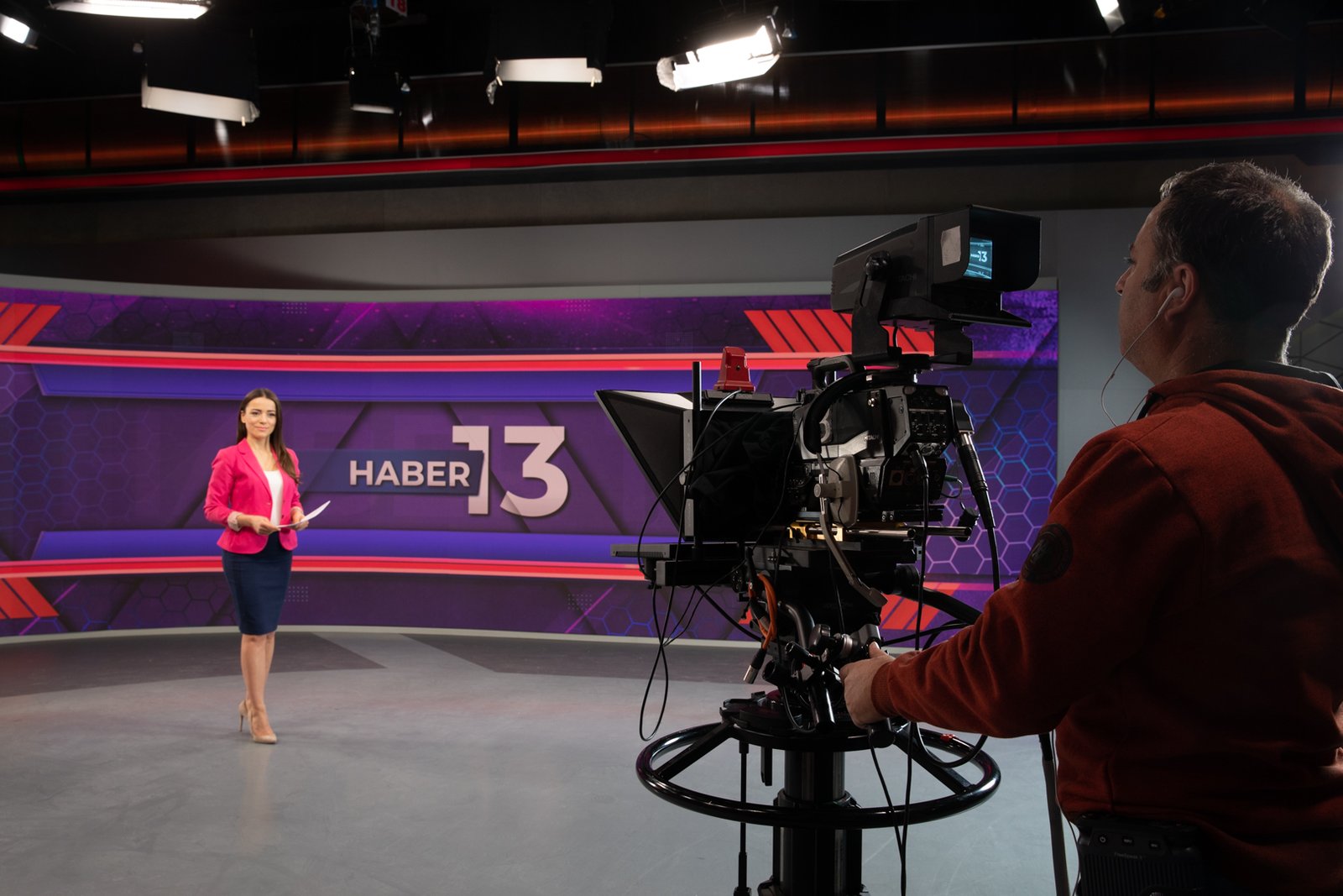 Behind the scenes of TRT Haber television broadcasting operations, featuring news studios, production teams, broadcast technology and media professionals.