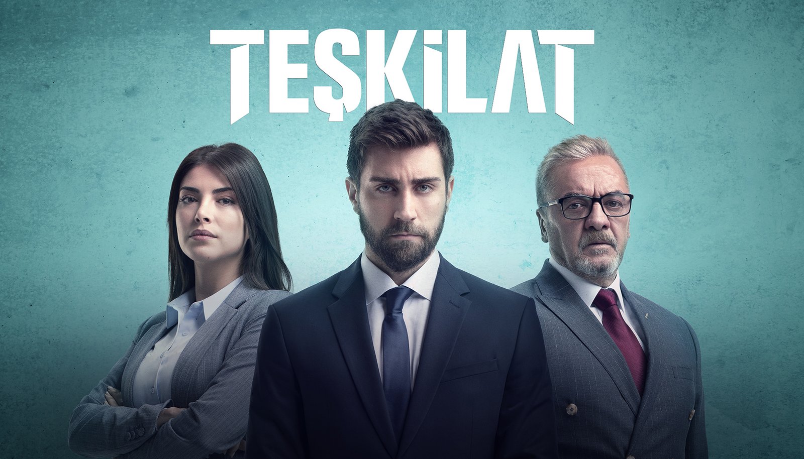 A wide horizontal commercial television promotional billboard by Sinan Niyazi Kutsal for TRT 1, showcasing the lead actors of Teşkilat including Çağlar Ertuğrul, Deniz Baysal, and Mesut Akusta posing in sharp corporate suits against a textured teal background.