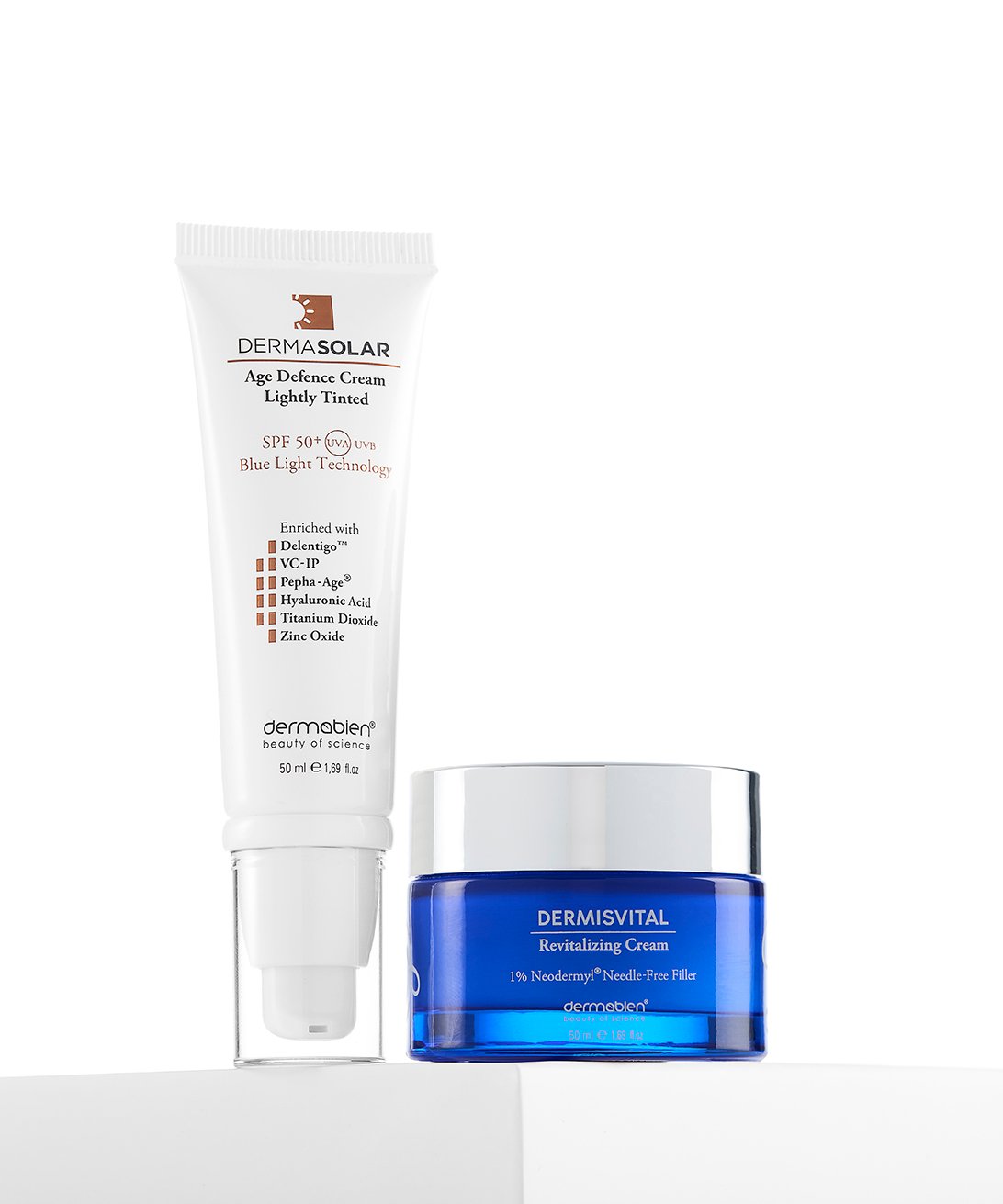 A clean commercial studio packshot photograph by Sinan Niyazi Kutsal for Dermabien, showing a white Acn-NON Clarifying Cleanser tube standing on a white pedestal with a green backdrop.