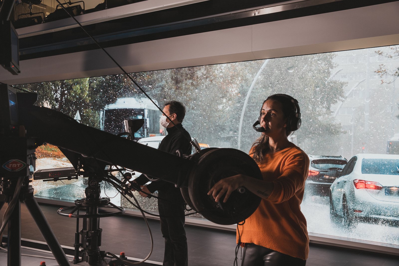Behind the scenes of TRT Haber television broadcasting operations, featuring news studios, production teams, broadcast technology and media professionals.