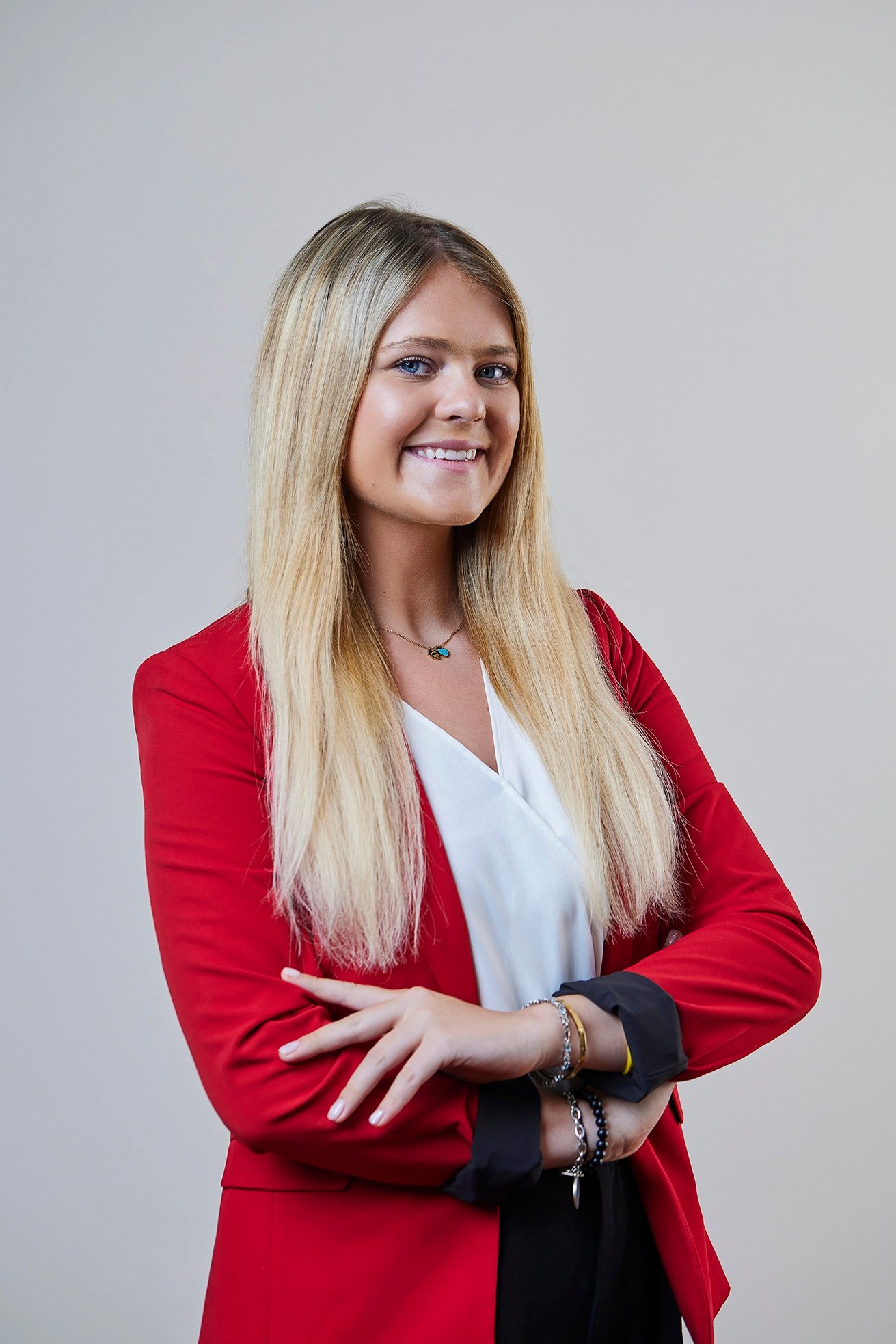 Professional executive portrait photographed in a corporate office environment.
